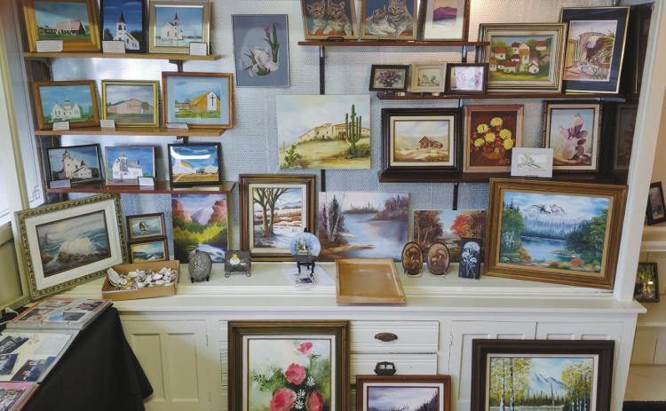 The silent auction space features a variety of art works donated by Leo Beauchamp and the family of Adeline Belanus for this year’s event.