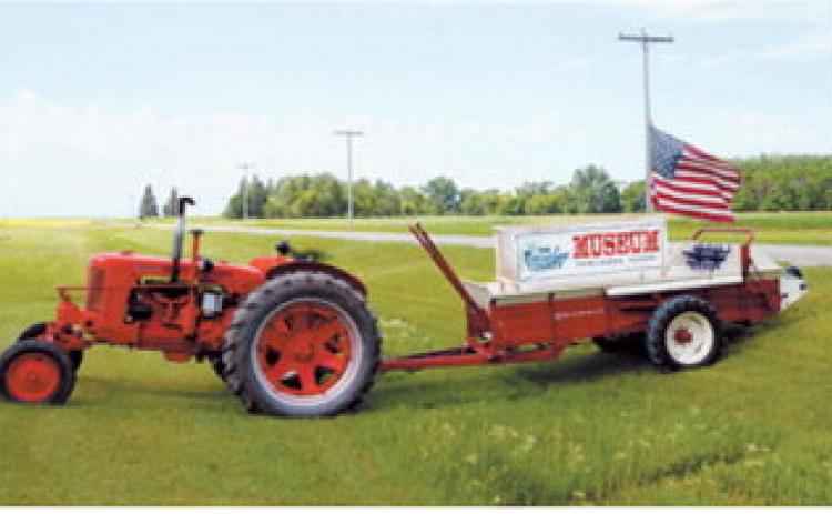 A vintage Case tractor and McCormick threshing machine welcome visitors to the Cavalier County Historical Society Museum in Dresden during the ninth annual Picnic at the Museum and Threshing Event on July 19. Photo by Larry Stokke