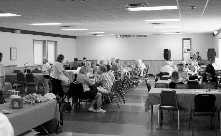 Hotdogs and hamburgers were fresh off the grill and food was accompanied by live music. Photo by Larry Stokke.