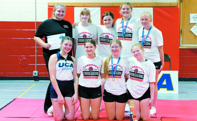 The Cardinals cheerleading team. Back row (L-R) Coach Sierra Ferdon, Daisy Kuhn, Ruby Davis, Izzy Vikan, Jaymee Reidhammer; front row, (L-R) UCA Staff Member Shay, Eliot Olson, Maci Hoffarth, Hopelyn Strelow. Photo by Larry Stokke.