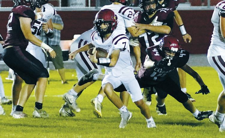 Connor Mitchell came in as quarterback in the 4th quarter and carried the ball forward for a first down. Photo by Larry Stokke.