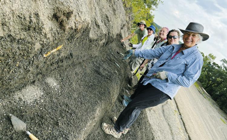 From left to right (back to front) intern Kale Link, paleontologist Cathy Lash, participants Emily Foyt, Angela Murphy, and Denise Steinbach, all working to clear off a bench of debris, while looking for weathered out fossils. Photo courtesy of N.D. Geological Survey.