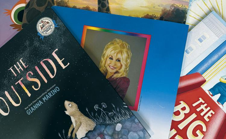 Dolly Parton smiles from the back cover of one of the many books distributed through her Imagination Library, a program that has benefited children throughout Cavalier County. Photo by Sarah Overby