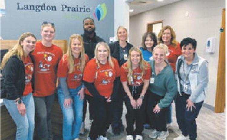 Representatives from Team Scrappy, Langdon Prairie Health and Cavalier County Public Health gather during the recent free skin-check event promoting melanoma awareness and early detection. Submitted photo
