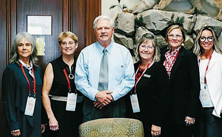 From (L-R) Mary Ellen Kirking, Linda Thorson, Senator John Hoeven, Karen Anderson, Sandy Sanford, and Jennifer Benson at the CWA summit.