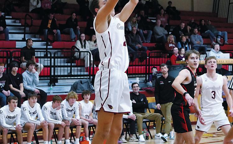 Tanner McDonald adds two points to the board in the game against Larimore. Photo by Larry Stokke.