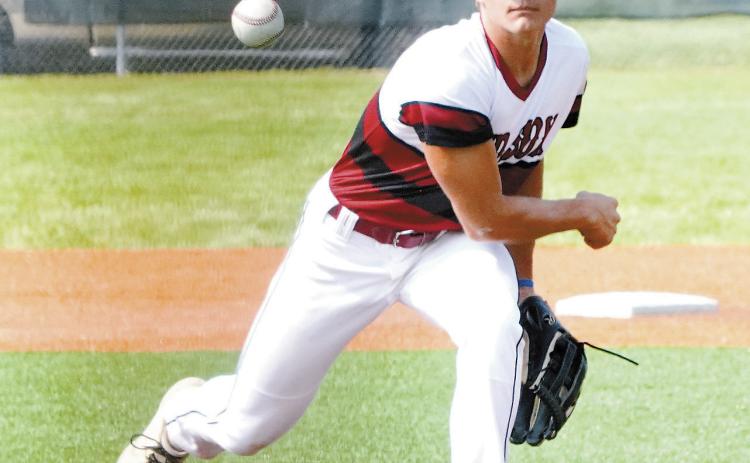 Nick Kingzett eyes the batter and sends a strike across the plate. Photo by Larry Stokke.