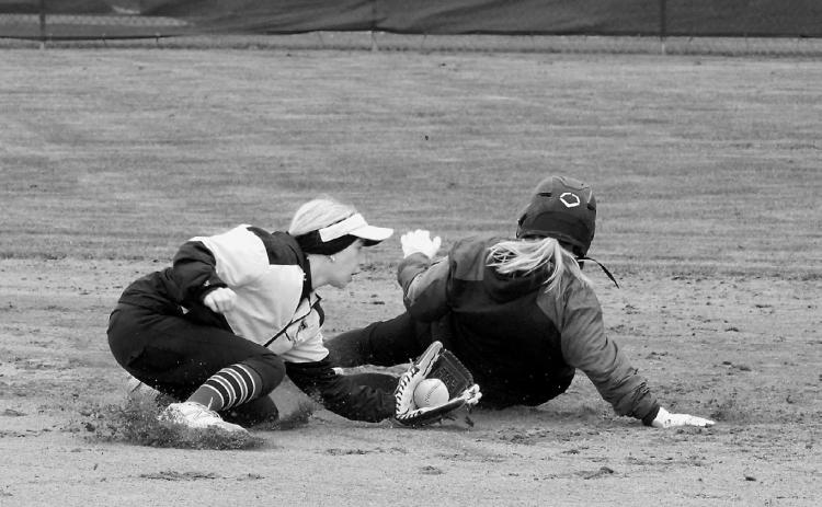 Raeleigh Ratzlaff slides safely into second base in Thompson on May 17. Photo by Larry Stokke.