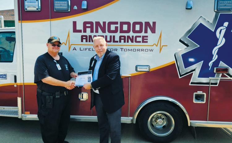 From (L-R) Chris Sanders, EMS Director, and Wayne Reid, CEO of Langdon Prairie Health. Photo by Hilary Nowatzki.