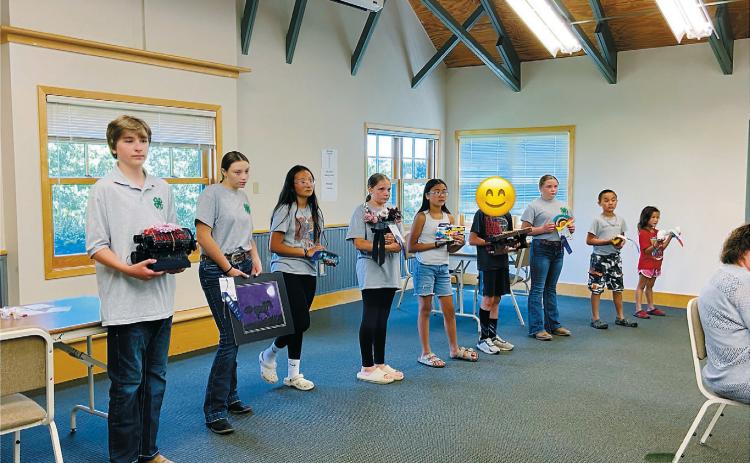 Cavalier County 4-H members pose with the projects and awards they received during 4-H Achievement Day on June 16 at the Langdon Research Extension Center.