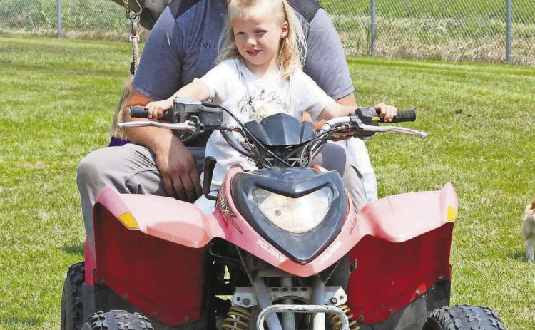 A 4Her takes a four-wheeler ride while in Hamilton for the 4H Horse Show. PHOTO BY LARRY STOKKE.