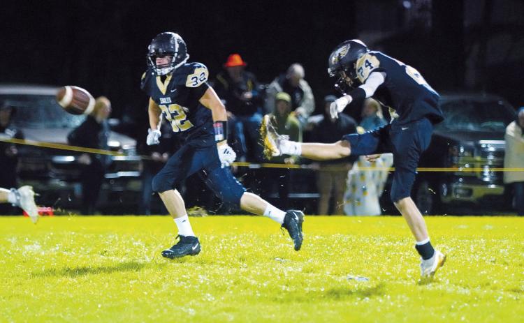 Ryder Girodat kicks the ball, leading up to the Eagles win over North Star in Pembina 9-13. Photo by Larry Stokke.