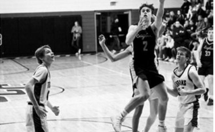 After a steal, Kaden Moore converts on the other end for a layup. Photo by Ashley Schafer