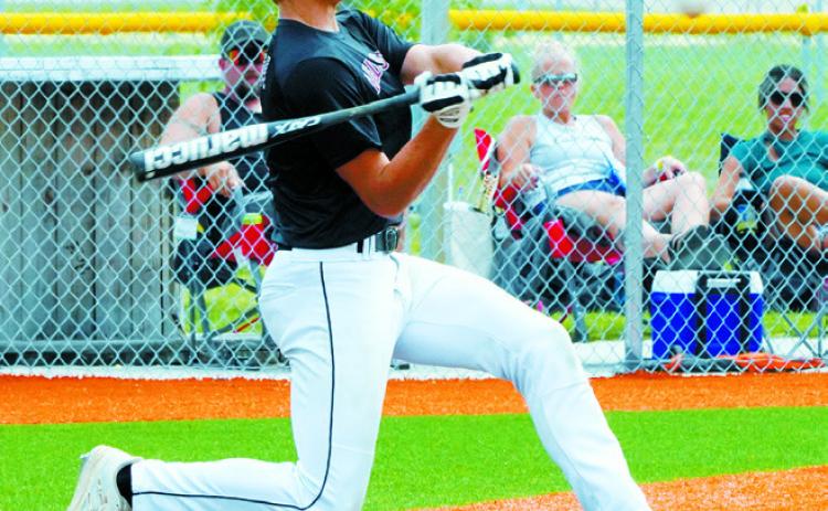 Jax Johnson connects for a base hit. Photo by Larry Stokke.