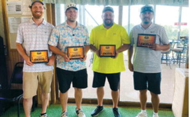 From left, Cullen Blair, Ryley Cleem, Reed Erickson and Mingo claimed first place at the Walhalla Swimming Pool Fundraiser Golf Tournament on July 11. Submitted photo