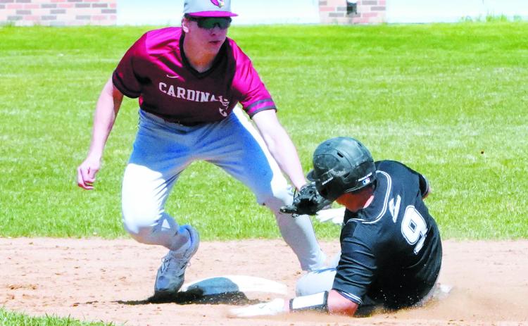 Jax Johnson tags out a Nelson County player at second base. Photo by Larry Stokke.