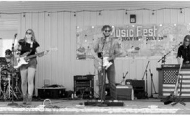 Auto Drive was among the many musical acts that kept crowds entertained throughout Rendezvous Region Music Fest in Langdon. The Starkweather-based band is wrapping up its final summer tour together. Photo by Larry Stokke