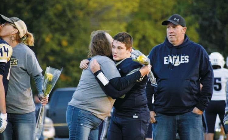 David O’Connor with his parents Chris and Amanda O’Connor. Photo by Ashley Schafer.