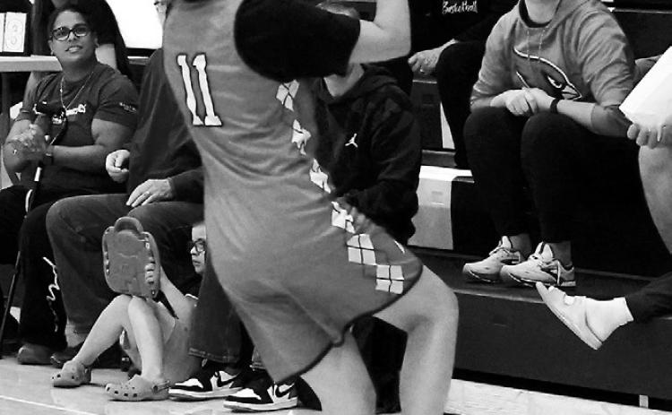 Brooklyn Mondor drives into the lane on a fastbreak and drops in a layup. Photo by Larry Stokke.