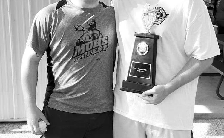 Danny Muhs with Cole Darling, winner of this summer’s rib cook off.