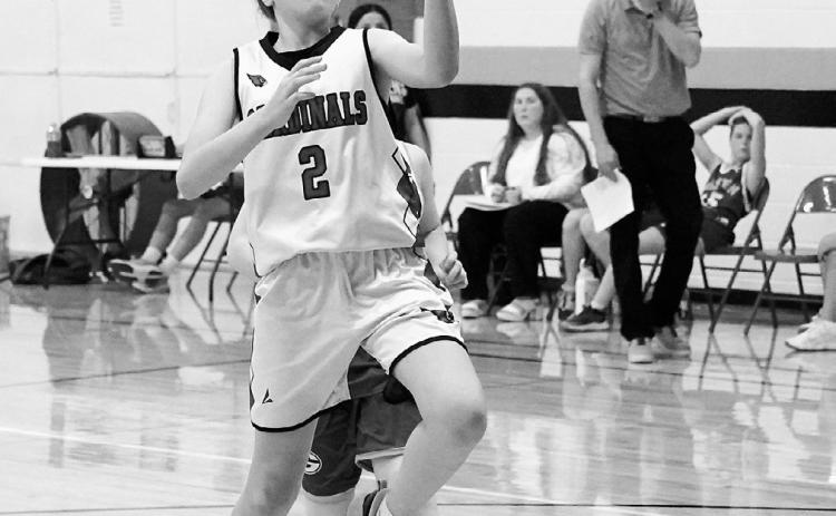 Sadie Pankratz drives in and drops a left handed lay-up in the Cards' win over the Spoilers. Photo by Larry Stokke.