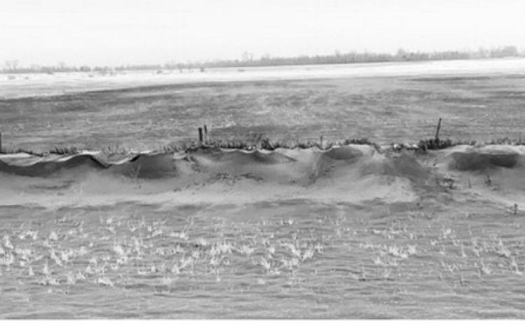 A roadside ditch along Highway 2, about 5 miles west of Grand Forks, North Dakota, full of topsoil from the adjoining field that was tilled in the fall. (NDSU photo).