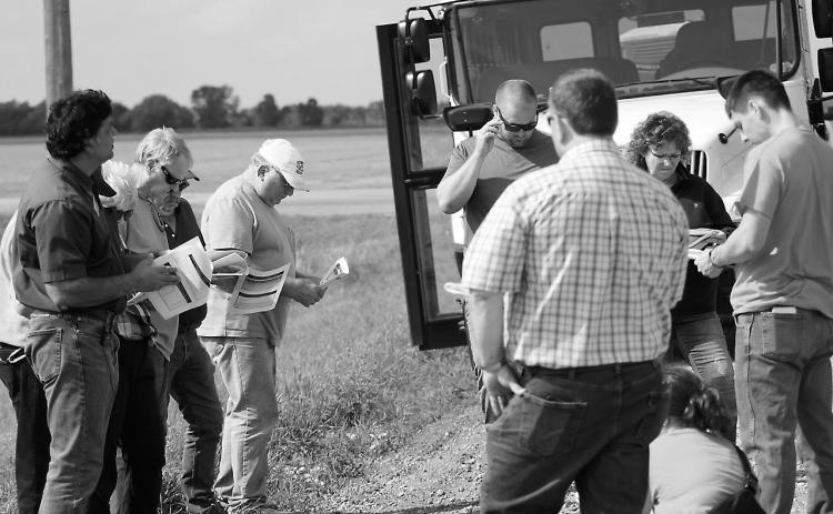 A Walsh County Soil Health Tour brought together 40 participants to learn more about soil loss, erosion and soil health in July 2023. Here, Naeem Kalwar [left side in the green shirt], a soil health specialist from the NDSU Langdon Research Extension Center, leads the talk. Photo provided by Josh Anderson, Walsh County district conservation manager.