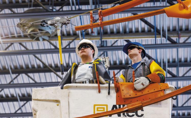 North Dakota electric cooperative lineworkers participate in hotline school at the Lineworker Training Center in Mandan in May 2025. The essential training prepares apprenticeship and journeyman lineworkers to safely work on energized power lines. Photo provided by NDAREC.