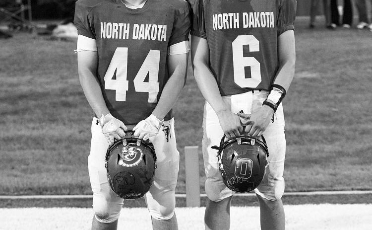 Shrine Bowl players Cole Welsh (left), and Rayce Worley, (right). Photo by Larry Stokke.