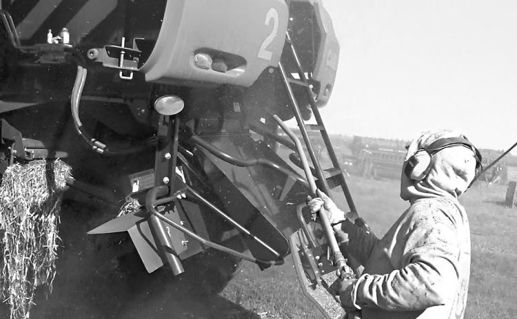 Use an air compressor or leaf blower every day when the machine is off and cooled down to remove dirt, dust, chaff and other plant residue that has accumulated. (NDSU photo)