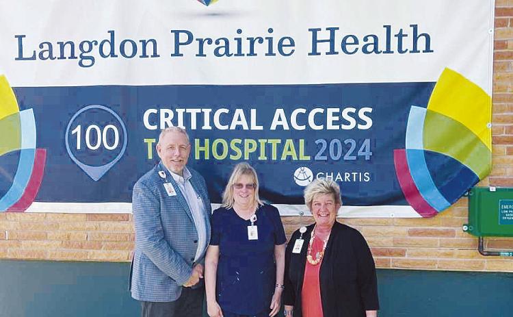 Wayne Reid, Michelle Skillings, and Darla Roder outside of Langdon Prairie Health. Photo by Jess Tull.