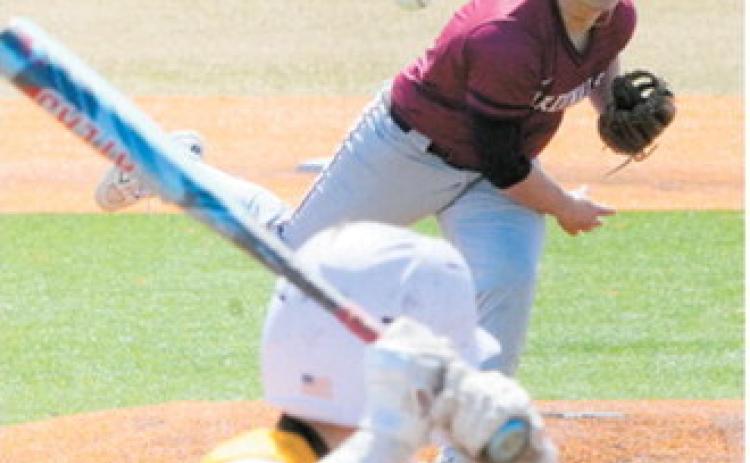 Theo Romfo sends a strike across the plate to strike out an Aggie batter. Photo by Larry Stokke