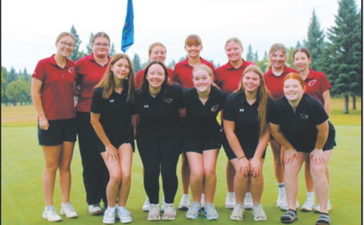 The Langdon Area Cardinals girls golf team celebrates a first-place team finish at the Langdon Invitational on Monday, Aug. 24. Photo courtesy of Jennifer Romfo