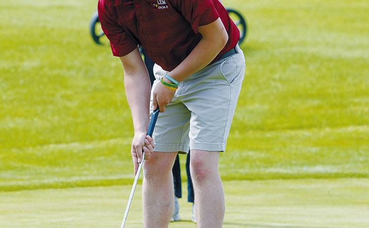 Tyler Kram putting for the Cardinals at state golf. Photo by Larry Stokke. cont’d. on page B2