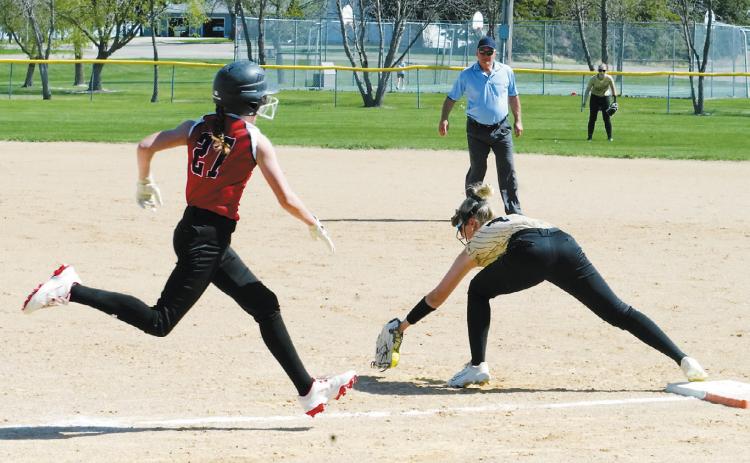 Hannah Russell with a catch at first base just in time to tag Lily Zimmer out in Munich on May 12. Photo by Larry Stokke.