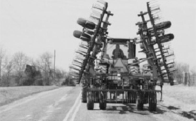 The responsibility of safely sharing the road during spring planting season falls on both farm equipment operators and general motorists. (Upper Midwest Agricultural Safety and Health photo)