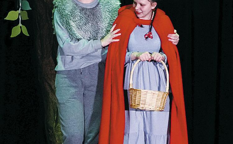 Pictured are members of the cast of Red vs. the Wolf, which was performed at North Border Pembina. Georgia Evenson played the part of the Wolf, and Jasmine Burch played Red. Photo by Larry Stokke.
