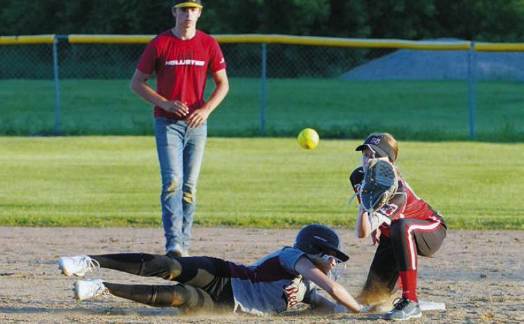 Jada Moen slides safely back to second base. Photo by Larry Stokke.