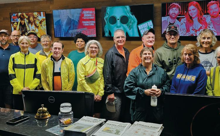 The CanDak cycling group touring the offices of Simmons Multimedia as a part of their week-long adventure through Pembina, Walhalla, Langdon, Graham’s Island, Park River, and Hallock. Photo by Nick Vorlage.
