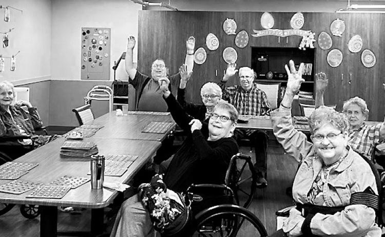 Residents celebrating their zero-deficiency survey results from the state.
