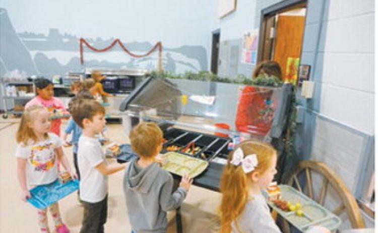 Students at Roosevelt Elementary School in Bismarck line up for lunch. (Photo Michael Standaert)