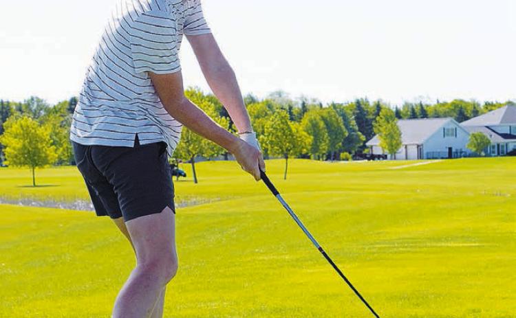 North Border golfer, Bjorn Evenson, takes a swing at state golf. Photo by Larry Stokke.