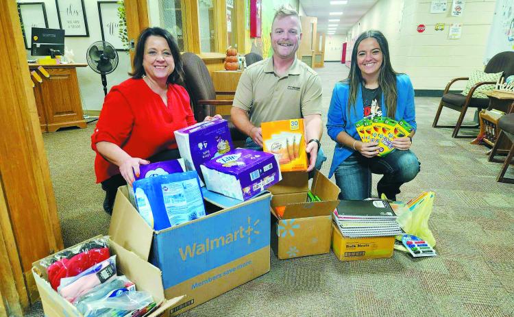 From left to right, LeeAnn Charon, Ryan Beattie, and Jayce Bata at Langdon Elementary School on Sept. 17. Photo by Hilary Nowatzki.