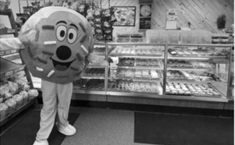 Bread Pan Bakery's new donut mascot made its debut during the bakery's National Donut Day celebration. The bakery set a goal of producing 2,700 donuts overnight and sold out in less than seven hours. Submitted photo