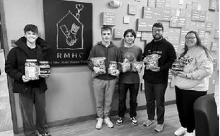 Pembina Honor Society students volunteered with Ronald McDonald House Charities, helping prepare meals and delivering donations collected by Pembina School students, including nearly 20 pounds of pop tabs and more than 100 donated items. Submitted photo