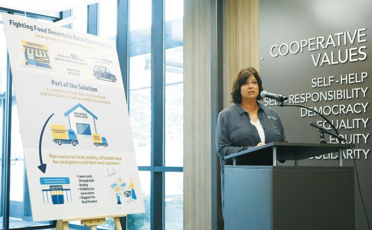 Ellen Huber, rural development director for the North Dakota Association of Rural Electric Cooperatives, speaks during a grant announcement on Aug. 4, 2025, in Mandan. The association is working to help sustain rural grocery stores. (Michael Achterling/North Dakota Monitor)