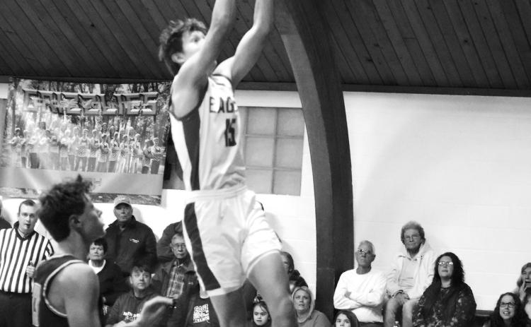 Garret Willits goes up for a hoop. Photo by Ashley Schafer.