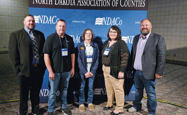 From left to right: NACo Executive Director Aaron Birst , NDACo President Jayme Tenneson, NDCCA President Joan Hollekim, EICG Award Recipient Revel Sapa, Pembina County Veterans Services Officer.