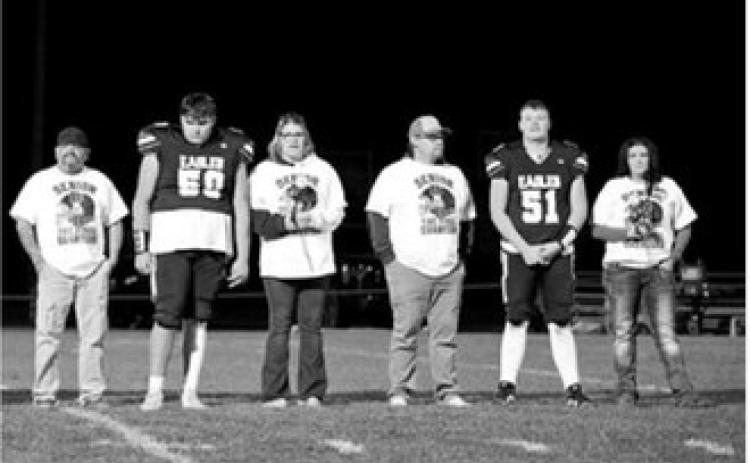 North Border seniors Cameron Saldana (50) and Trystan Moore (51) are recognized with their families during Senior Night on Oct. 2. Photo by Ashley Schafer