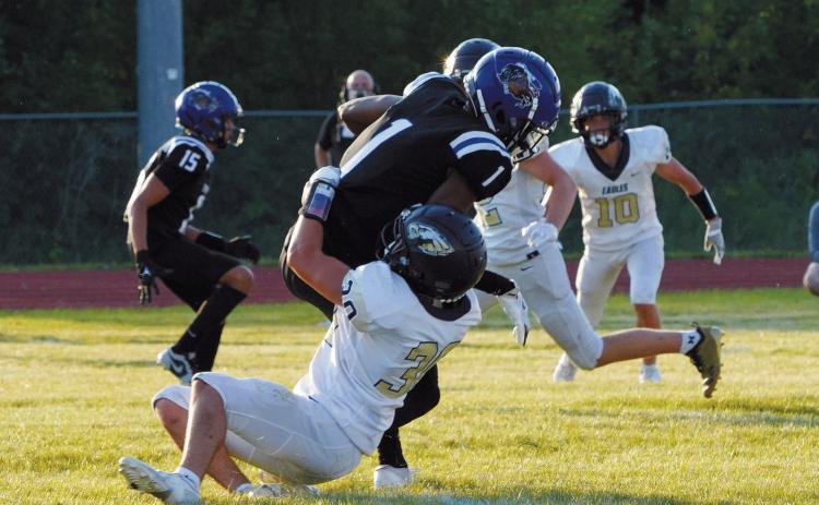 Brody Berg tackles Four Winds QB Kashton Keja in the Eagles win of the first game of the season. Photo by Larry Stokke.